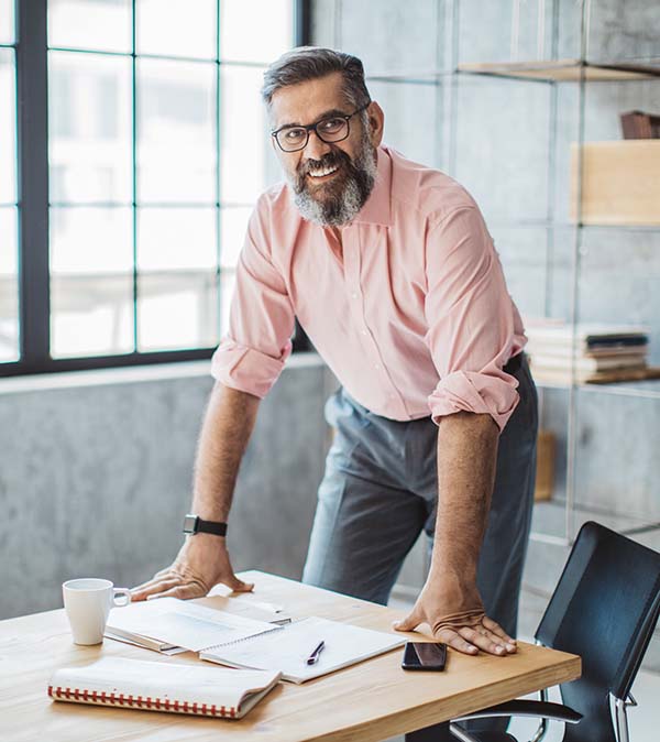 male executive at desk in business setting